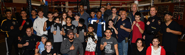 Youth boxing group with mayor